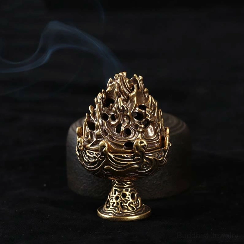 Vintage bronze Buddhist incense holder side close-up showing ornate relief carvings and subtle smoke rising, dark velvet background
