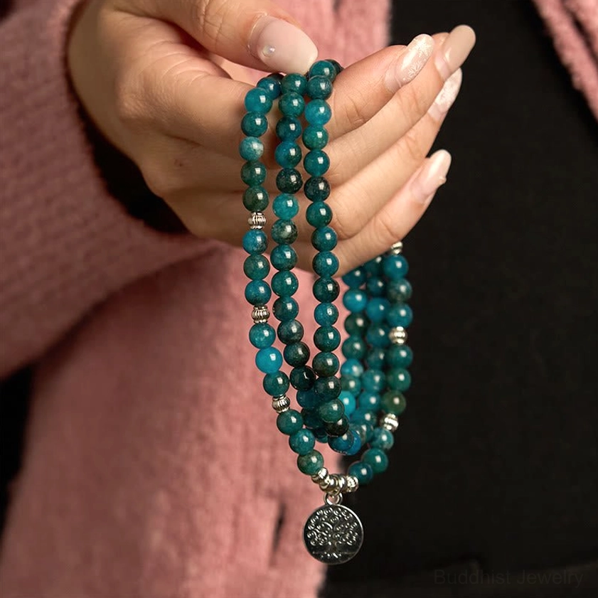 Apatite mala bead bracelet close-up hand-held view with multi-strand beads and silver Tree of Life drop charm