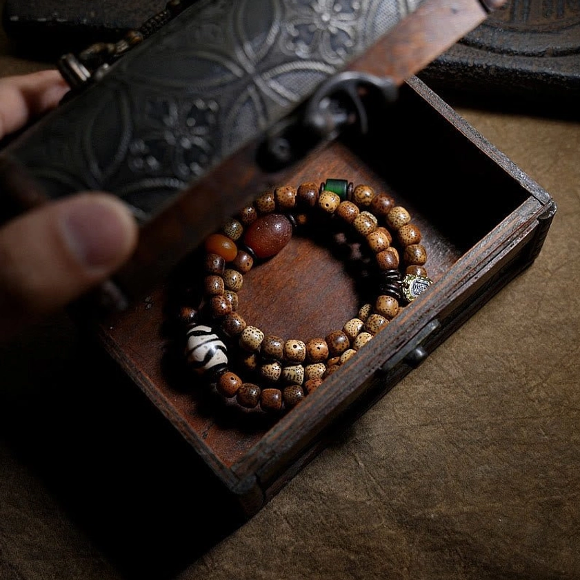 Artisan-crafted bodhi seed triple wrap bracelet with amber dzi agate for protection and wealth attraction
