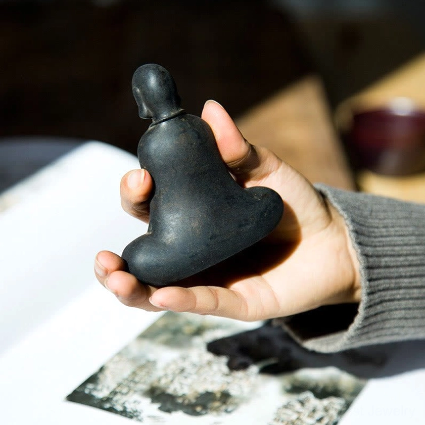 Artisan Buddha statue displaying handcrafted details and natural iron powder resin material quality