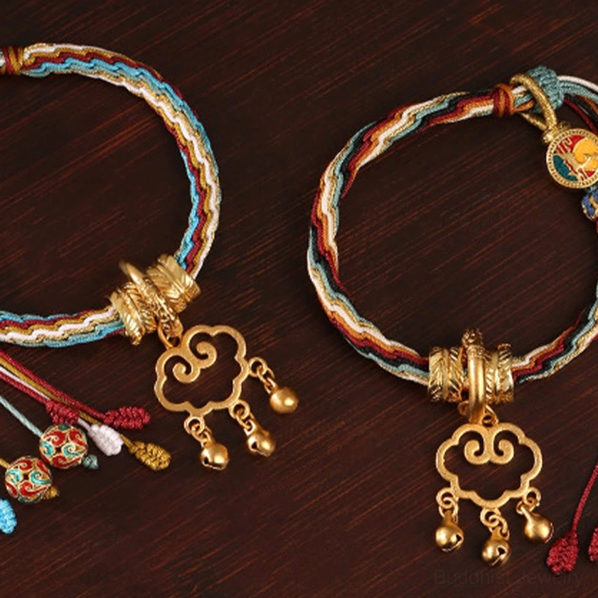Artisan handcrafted auspicious cloud lock bracelet with multicolor healing cord, antique gold hardware and traditional Buddhist symbolic charms