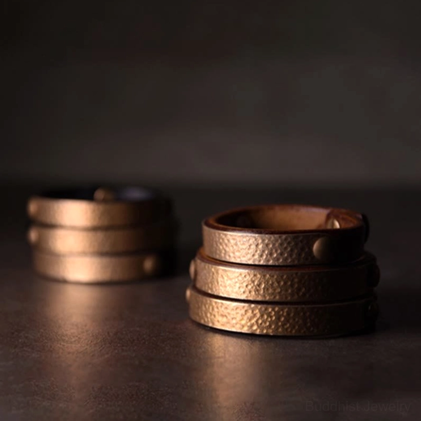 Artisan copper brass leather bangle showcasing hammered metal work and natural material quality
