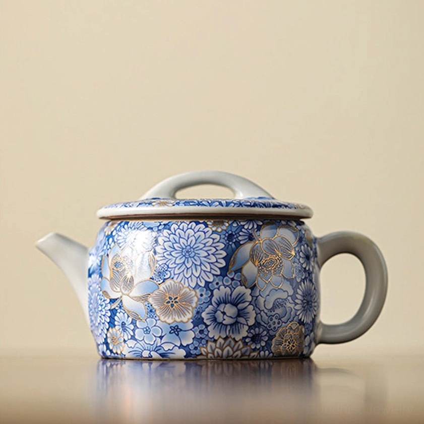 Master artisan crafted porcelain teacup gold gilt floral Buddhist tradition