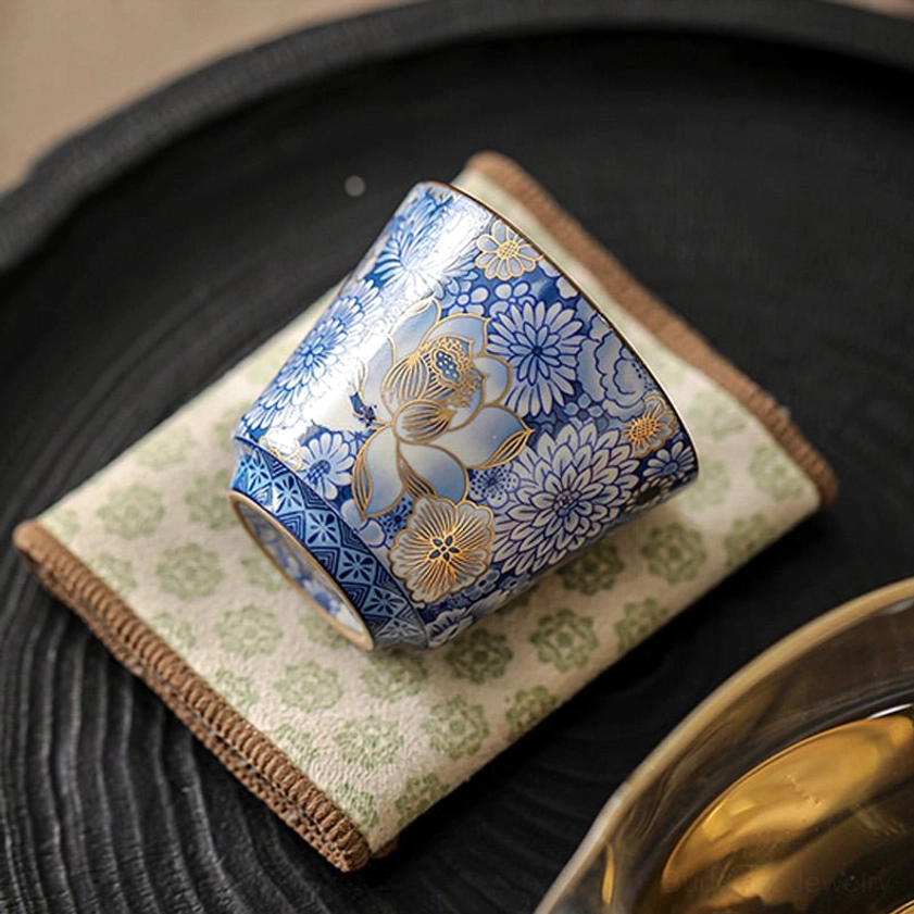 Premium artisan-made porcelain teacup with hand-painted blue and white gold gilt design