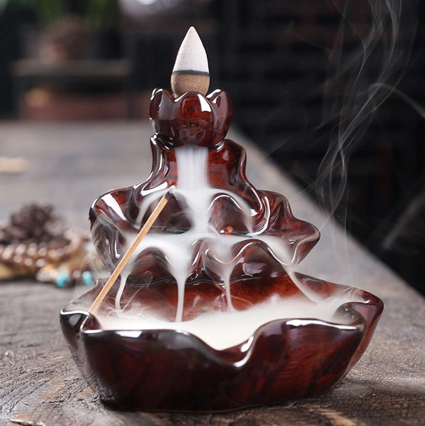 Artisan-crafted lotus incense burner with Buddhist symbolism