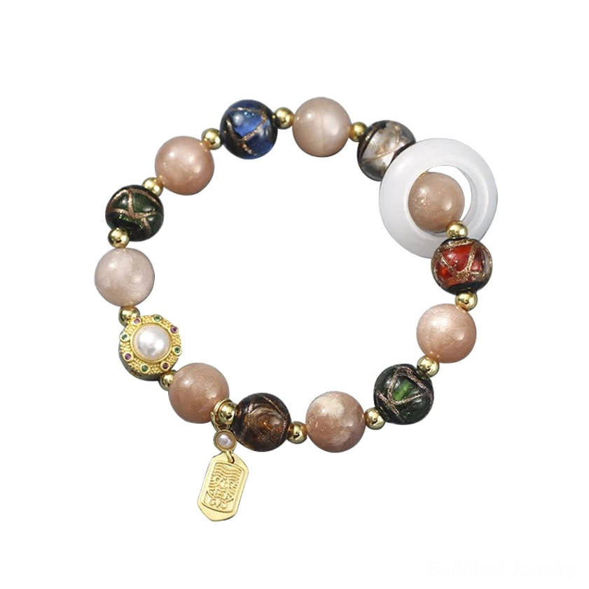 Artisan handmade prayer wheel bracelet combining Tridacna stone and sun stone for compassion and abundance