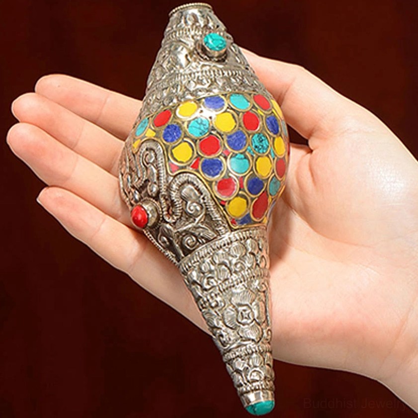 Artisan-crafted shankha conch shell decoration with natural materials and fine silver metalwork for spiritual space