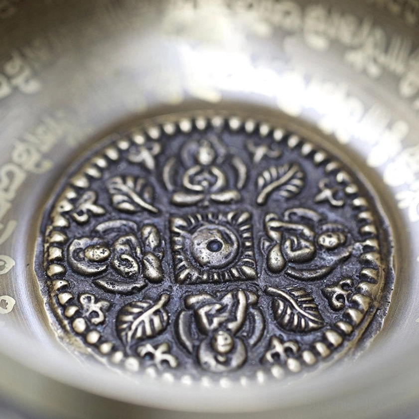 Handcrafted brass singing bowl showing natural surface texture, oxidation patina, and artisanal craftsmanship details