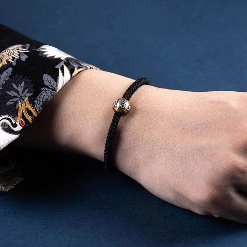 Artisanal Buddhist braided bracelet with natural rope materials, 925 silver components, and Om Mani Padme Hum spiritual mantra