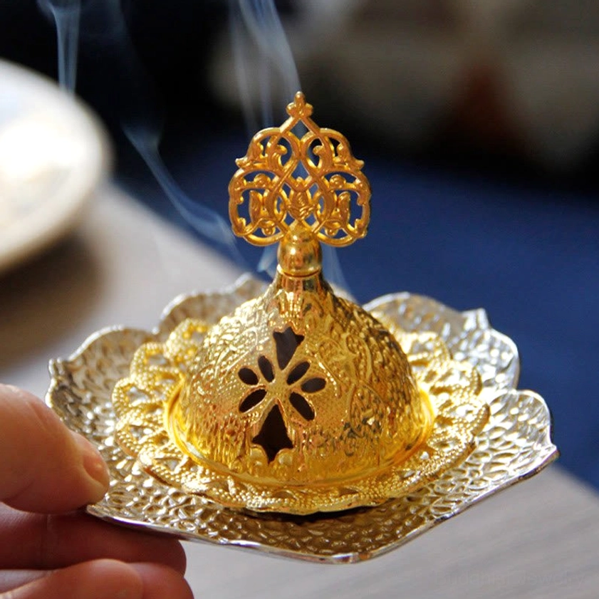 Artisanal Buddhist incense burner with floral embossed surface and removable component design