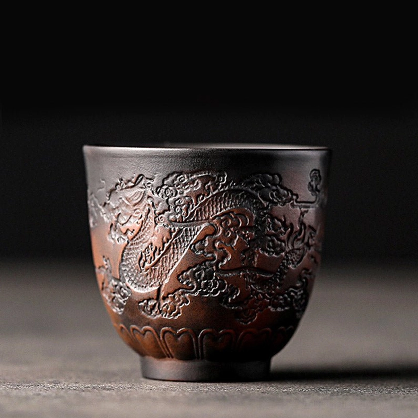 Auspicious dragon design ceramic kung fu tea cup with intricate embossing and protective symbolism