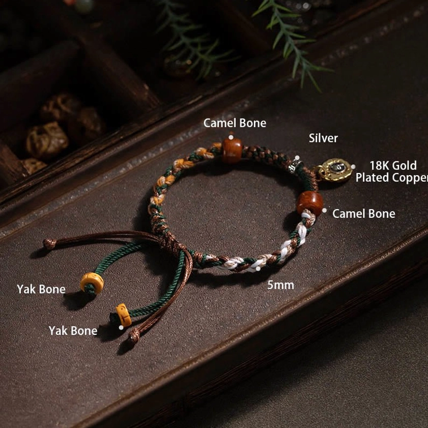 Authentic Buddhist protection string bracelet with woven natural rope, bone beads, and engraved metal pendant for daily spirituality