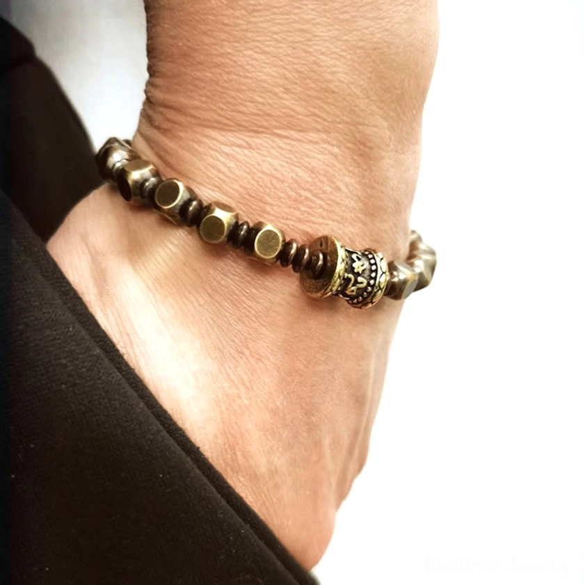 Authentic brass mantra bracelet featuring traditional Om Mani Padme Hum carving technique