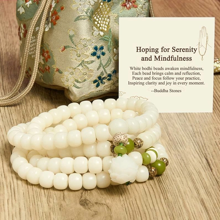 Authentic handmade white bodhi prayer beads with natural speckled texture detail, close-up view
