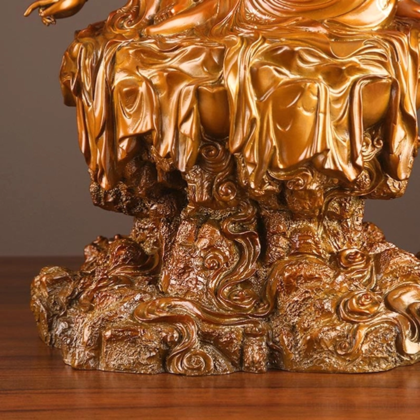 Avalokiteshvara four-armed Buddha statue complete view on wooden display with neutral brown background