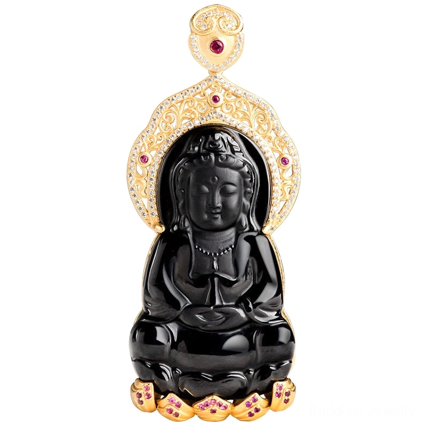 Black jade Avalokitesvara pendant close-up front view with polished surface, gold-plated decorative frame and red gemstone accents