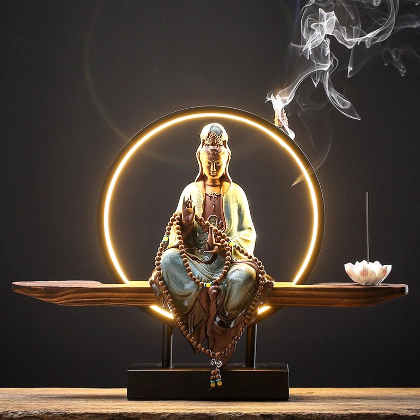 Blue Avalokitesvara backflow incense burner with LED halo creating meditation-focused ambiance