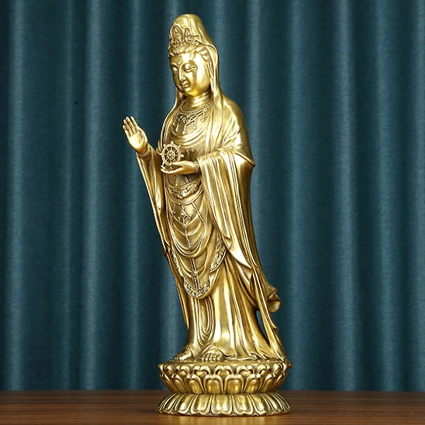 Avalokitesvara brass statue showing detailed facial features and hand gestures