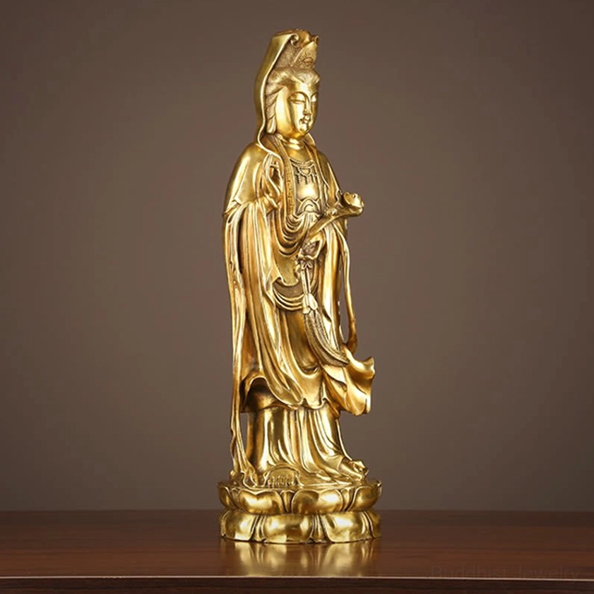 Avalokitesvara brass statue side view with ruyi scepter flowing robes golden bronze