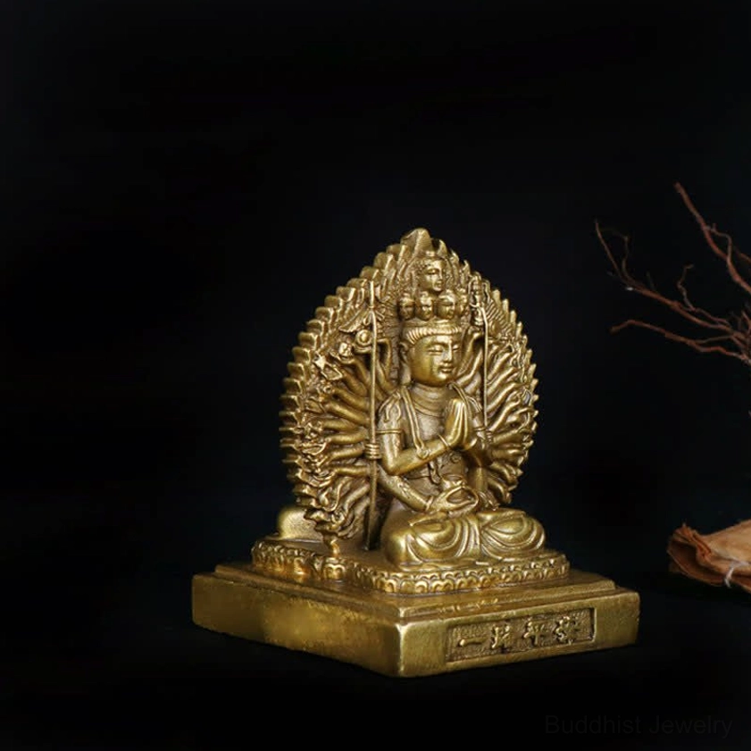 Thousand-armed Avalokitesvara statue front facing showing prayer hand mudra and complete mandorla back design
