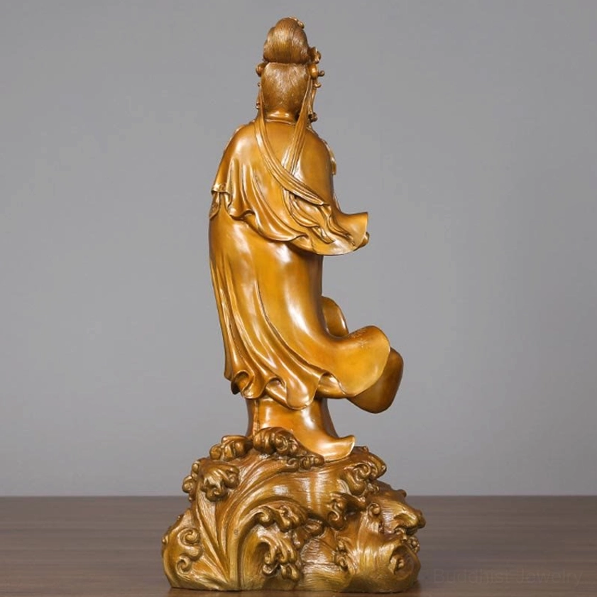 Full rear view of Avalokitesvara Guan Yin bronze statue showing ornate wave-carved base and complete back robe embellishments