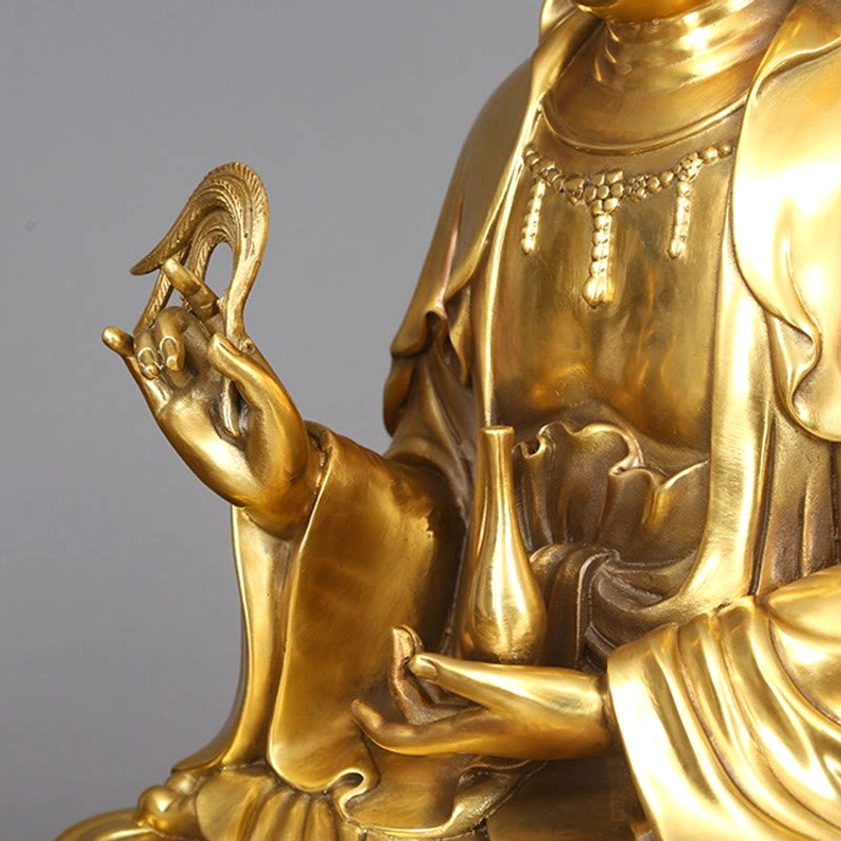 Avalokitesvara Guanyin brass statue detail of ornate crown and facial expression showing compassion