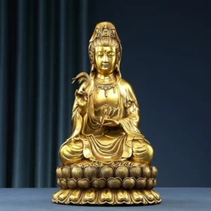 Avalokitesvara Guanyin brass statue with golden finish holding willow and healing vase, frontal view on dark blue background