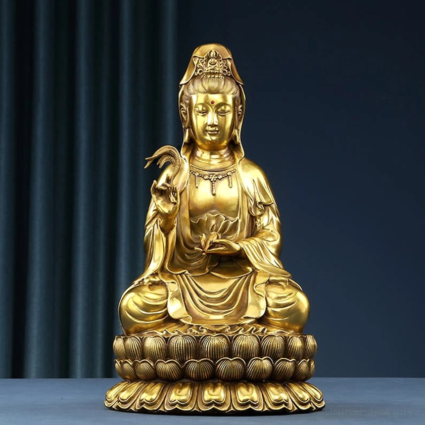 Avalokitesvara Guanyin brass statue with golden finish holding willow and healing vase, frontal view on dark blue background