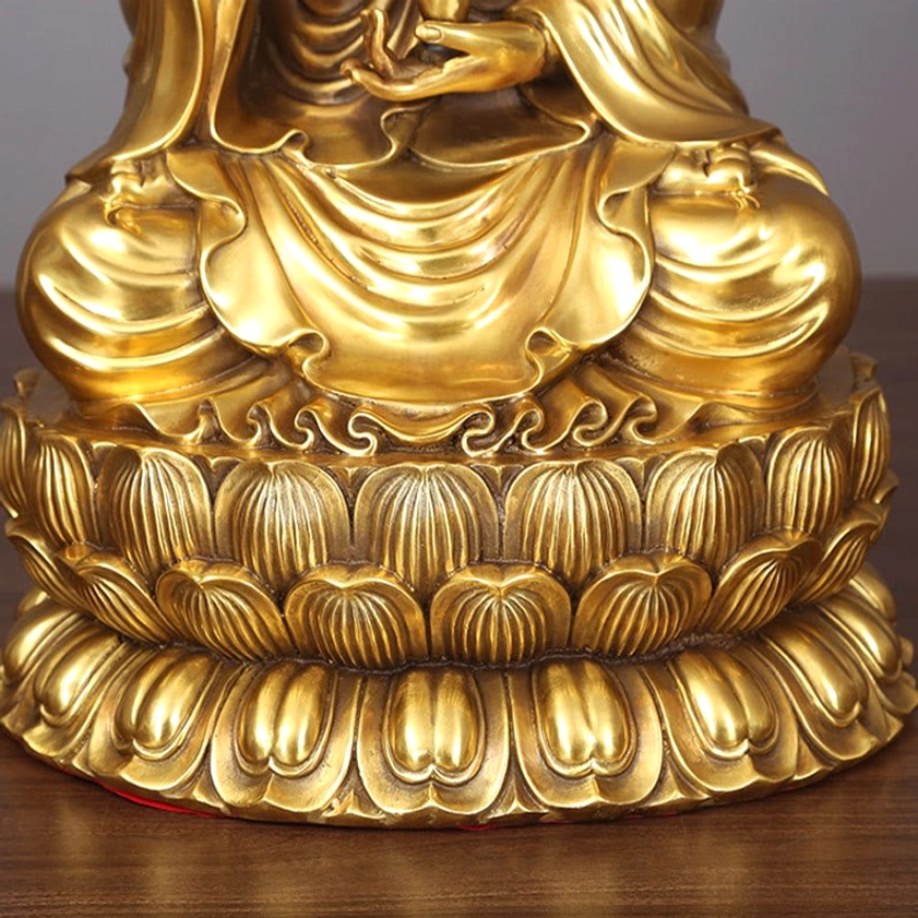 Avalokitesvara Guanyin brass statue showing robe texture and jewelry embellishments in golden finish