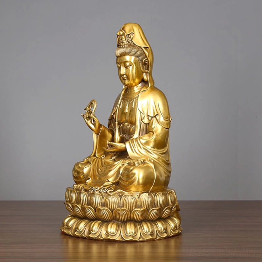 Avalokitesvara Guanyin brass statue three-quarter angle view showing ornamental details and golden patina