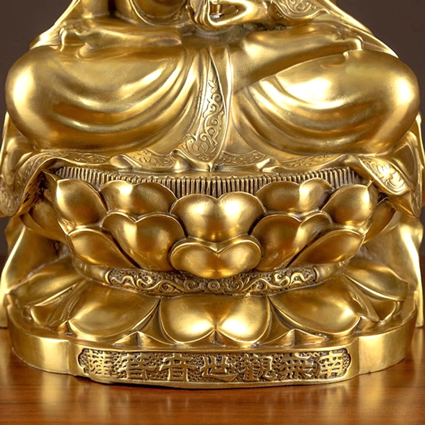 Brass Avalokitesvara Guanyin statue bottom view, hand-cast construction, engraved lotus throne details, artisan craftsmanship