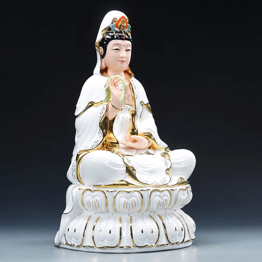 Avalokitesvara statue right side profile view holding willow sprig with gilded robes and gold accents