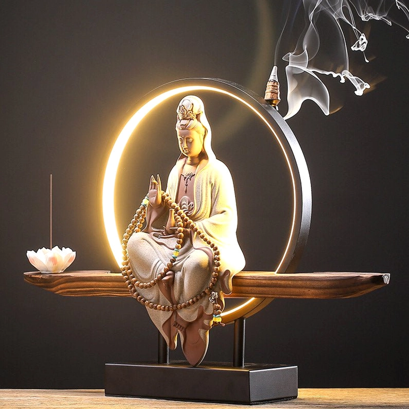 Handcrafted ceramic Avalokitesvara statue incense burner with intricate carving details and wooden pedestal