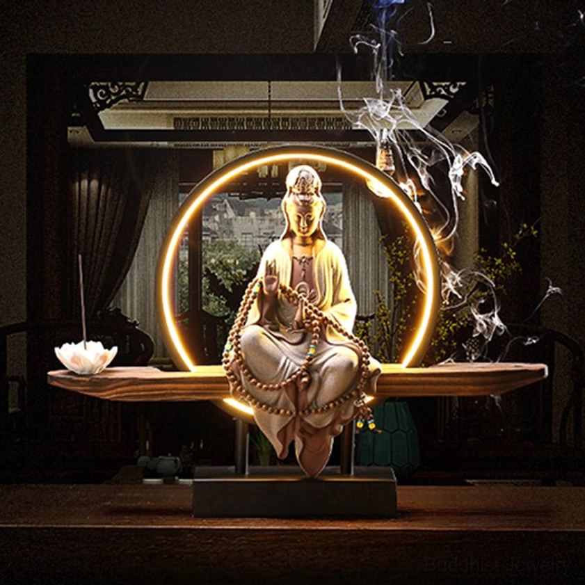 Avalokitesvara backflow incense burner in meditation room setting with window background and lotus incense tray