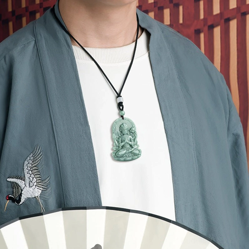 Man wearing Avalokitesvara jade pendant necklace close to heart in traditional styling