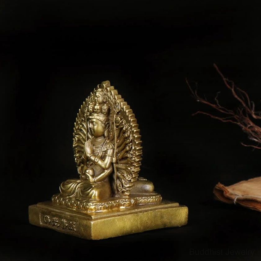 Avalokitesvara copper statue left-front angle with dark background displaying blessing base detail