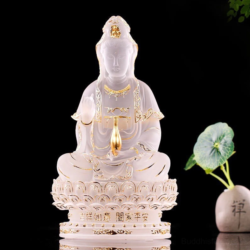 Avalokitesvara Guanyin Liuli crystal statue displayed with zen stone and green plant meditation decor home altar