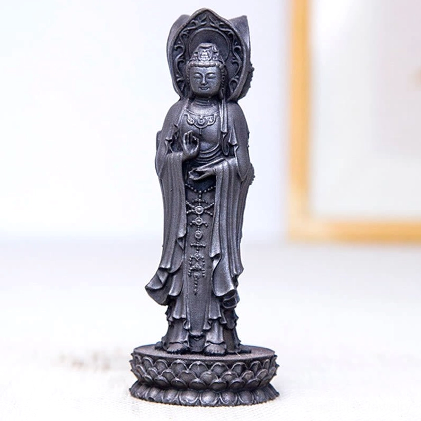 Guan Yin three-sided statue living room shelf display with warm lighting and home decor