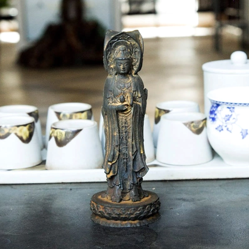 Avalokitesvara resin statue demonstrating multi-angle design with protective gaze from each face