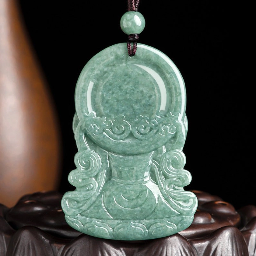 Reverse side of four-armed Avalokitesvara jade pendant showing cloud pattern carving