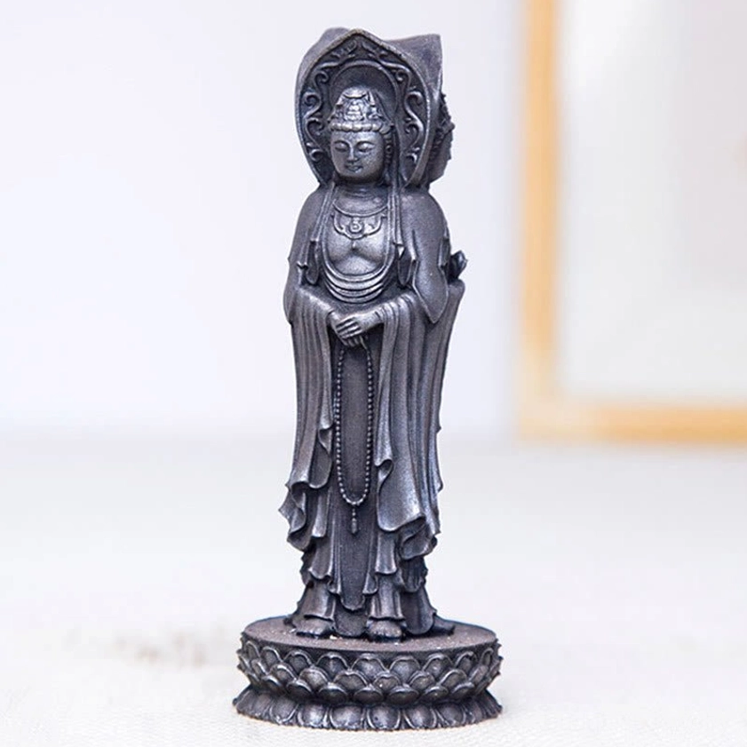 Three-faced Avalokitesvara Buddhist statue demonstrating protective energy and compassionate symbolism