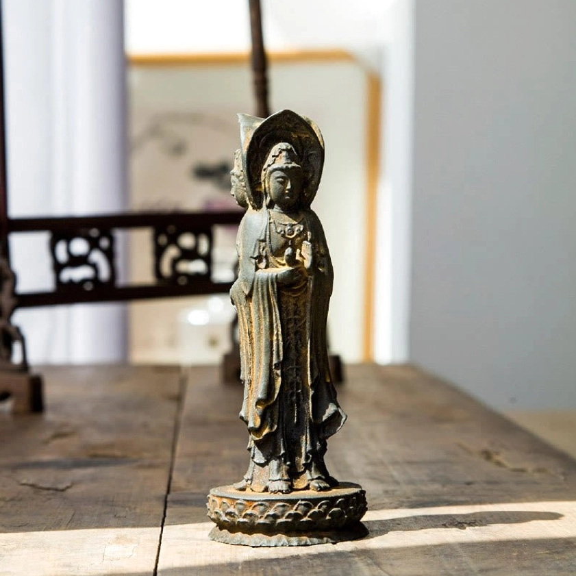 Avalokitesvara right side angle showing ritual implements and lotus pedestal base