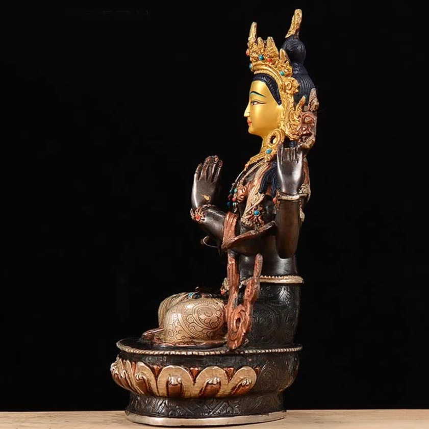 Right side silhouette of Avalokitesvara statue showing cross-legged seated position on lotus throne with gilded ornaments