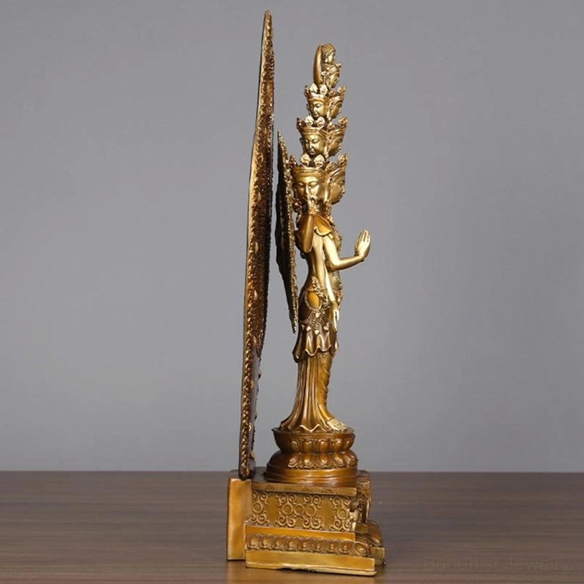 Avalokitesvara Guan Yin statue side profile view showing slim deity figure and tall ornate backboard