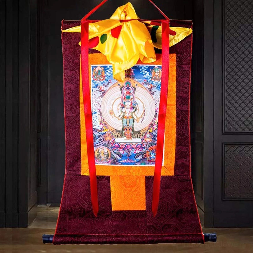 Thousand-handed Avalokitesvara thangka with black scroll rod and red ribbons in luxury wooden interior