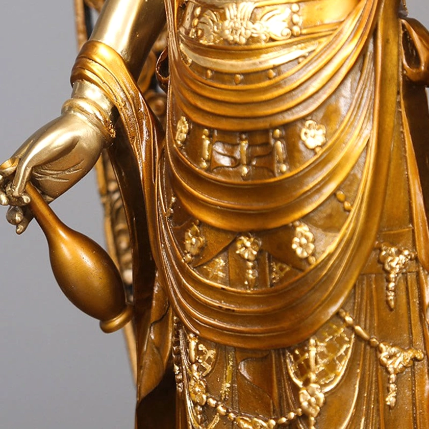 Avalokitesvara torso and hand detail - showing ornate engraved robes and ritual water vase held in hand
