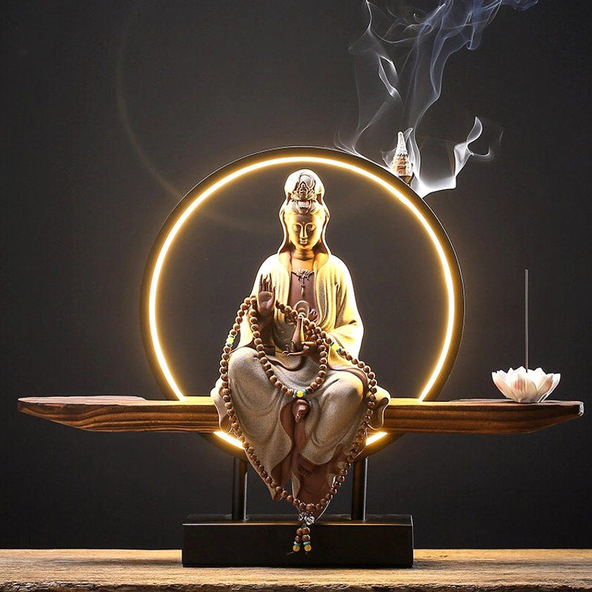 Avalokitesvara White ceramic incense burner with LED halo, prayer beads, and minimalist dark background