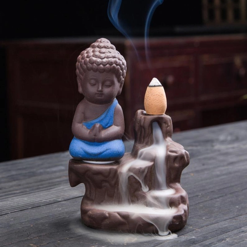 Lifestyle photo of monk backflow incense burner in meditation room creating calming waterfall smoke effect