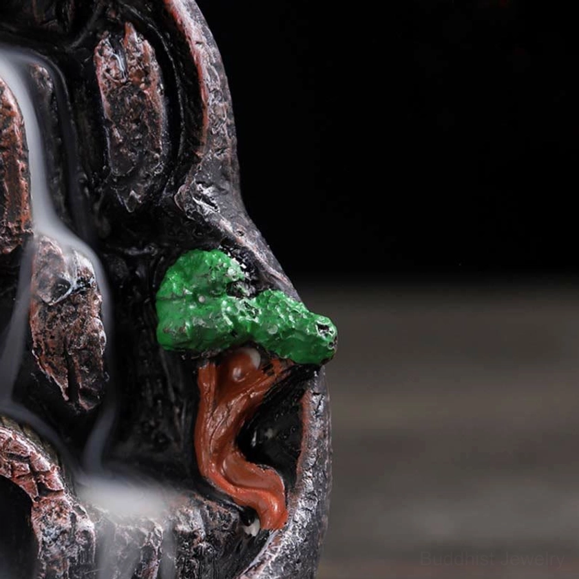 Detailed view of resin pine tree decorations and rock texture on backflow incense burner