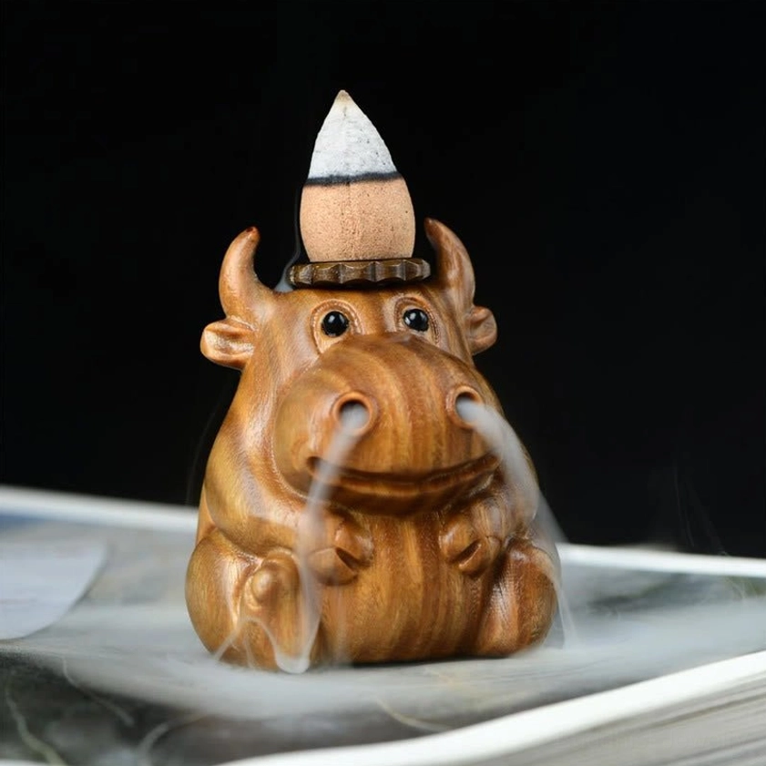 Backflow incense burner calf design with flowing smoke cascade, demonstrating the artistic waterfall effect